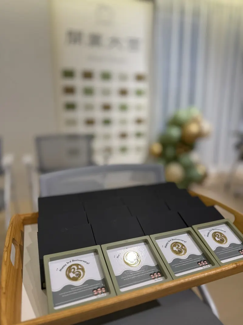 Third anniversary gifts arranged on a table