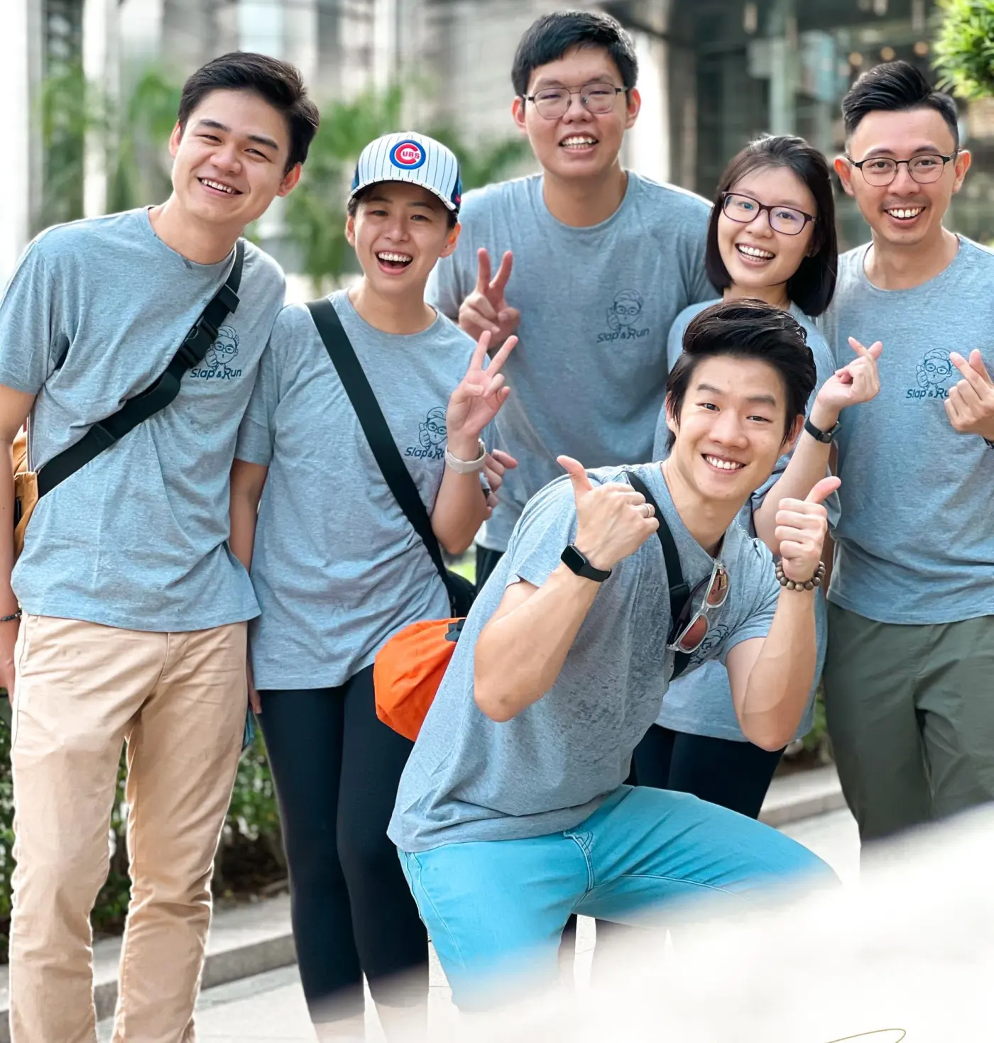 A team in matching shirts posing together during an outdoor activity